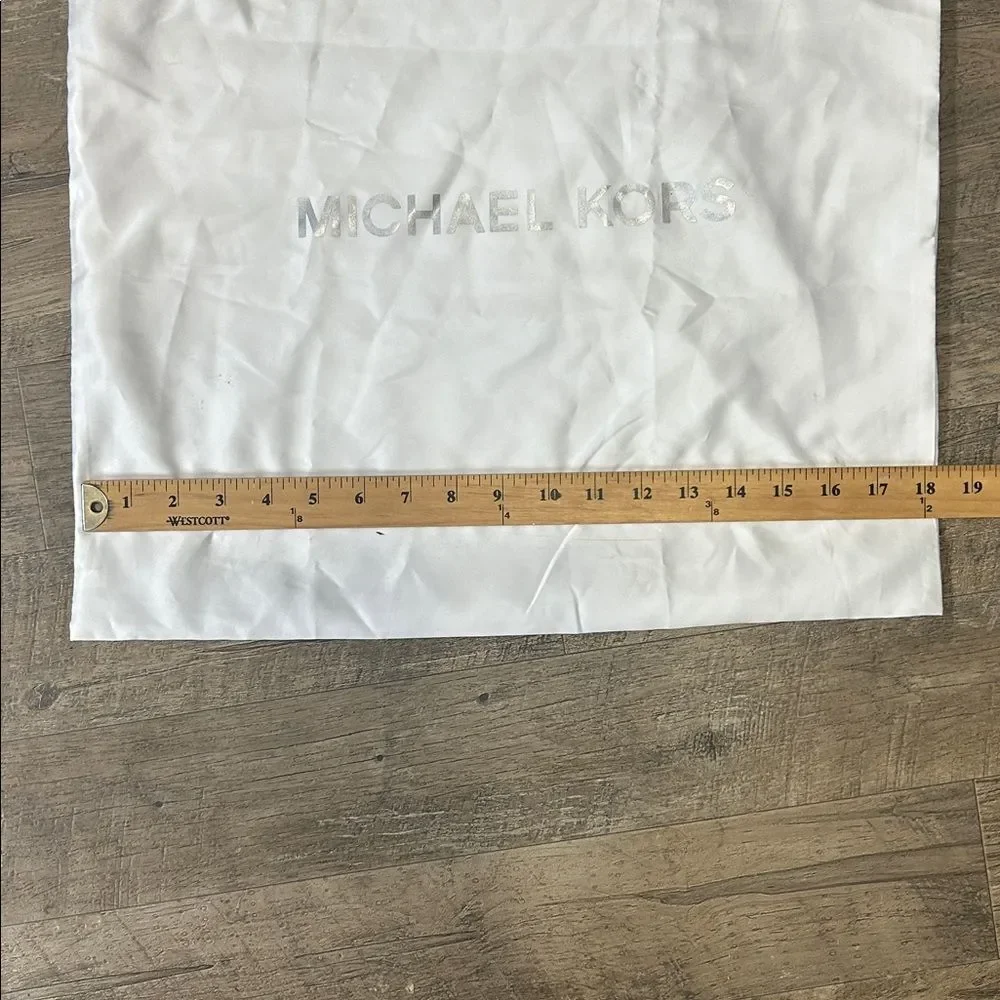 A13 | Michael Kors white dust jacket